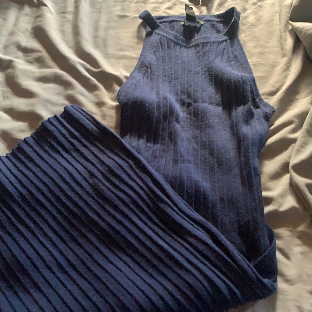 A knee length navy blue dress with a belt